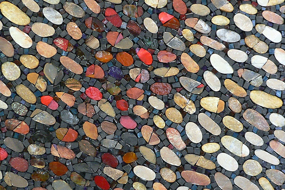 This peebles and smalti mosaic surface evokes an animal skin